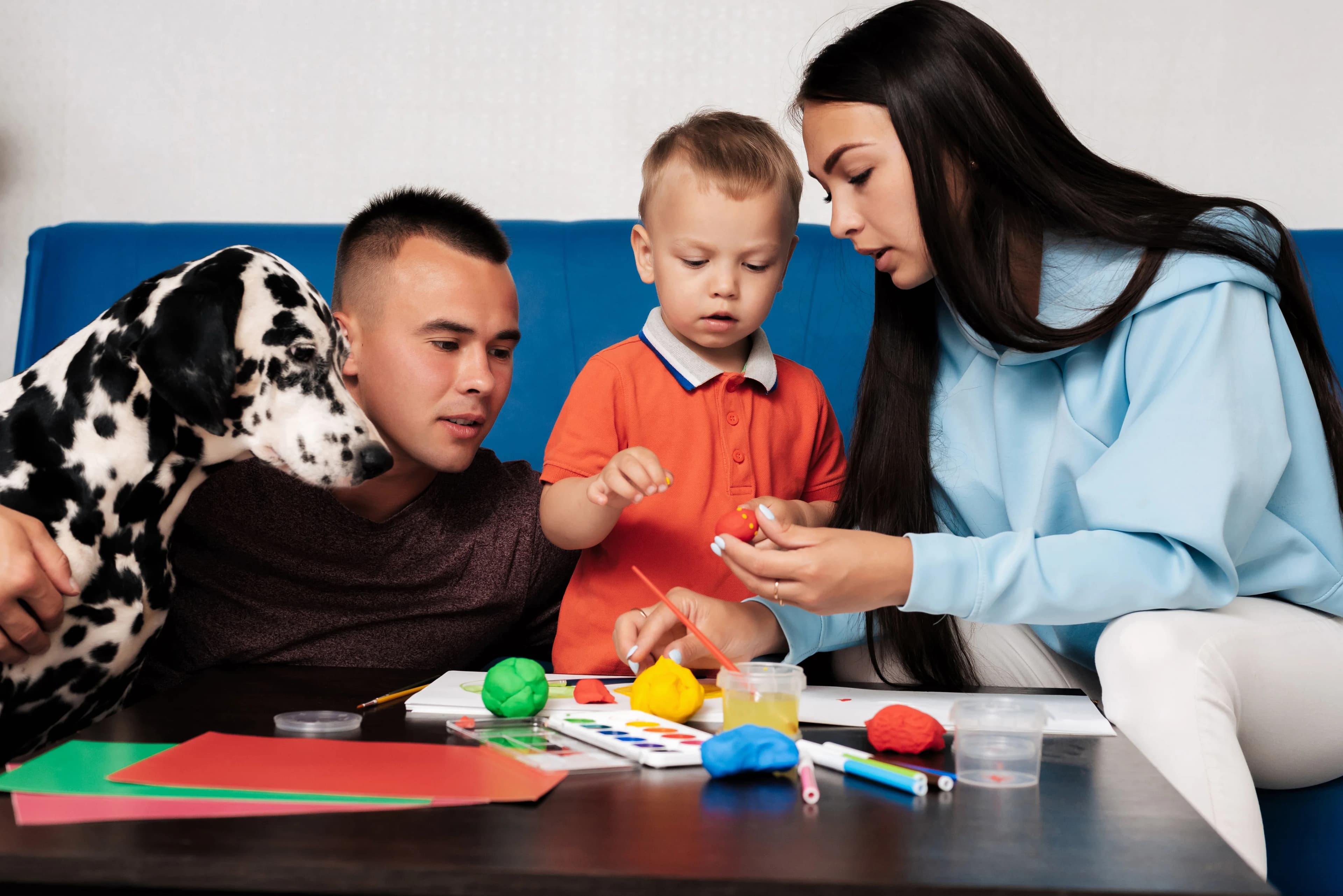 parents playing with their child in home