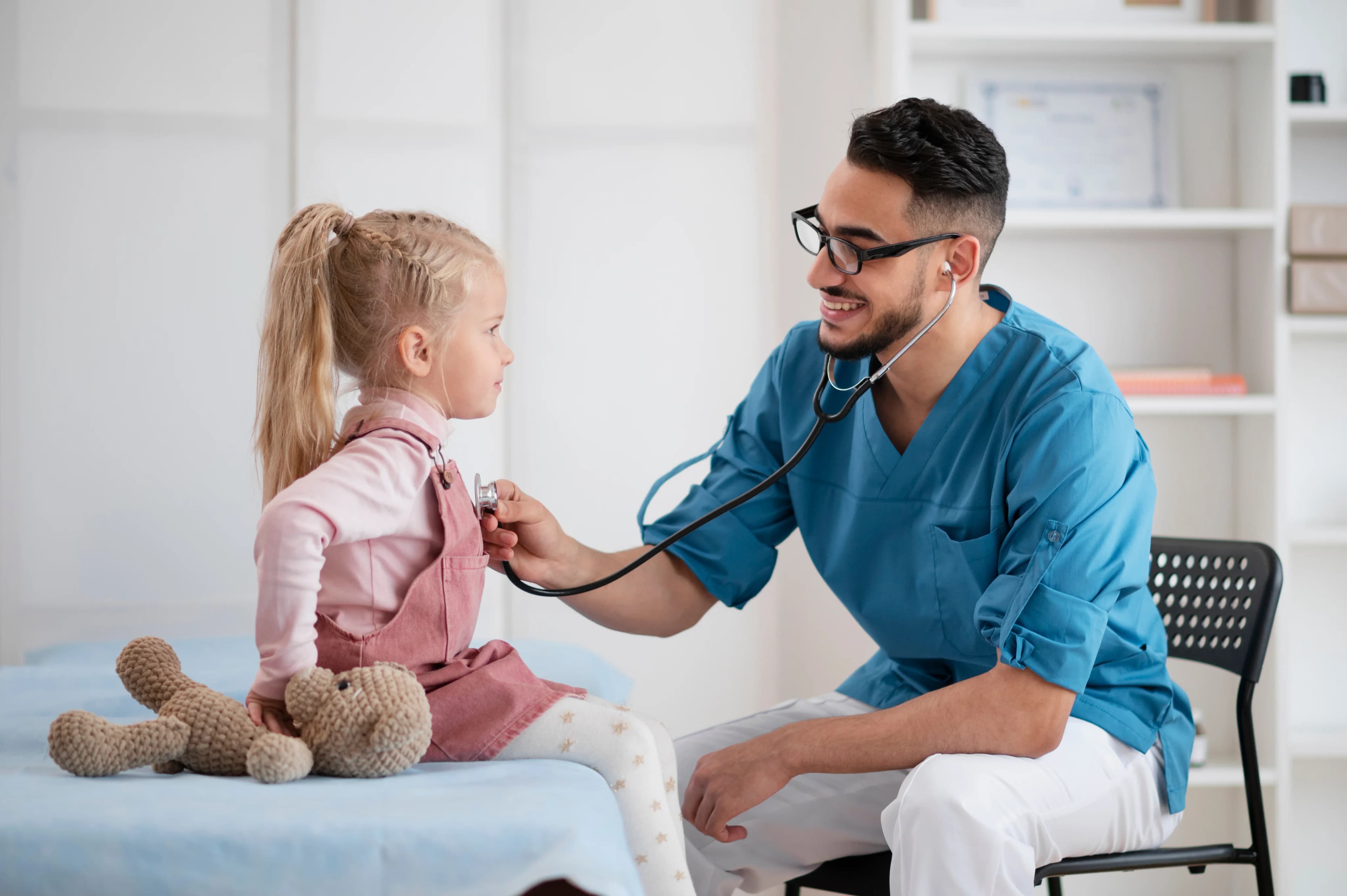a doctor treating a children with stethoscope